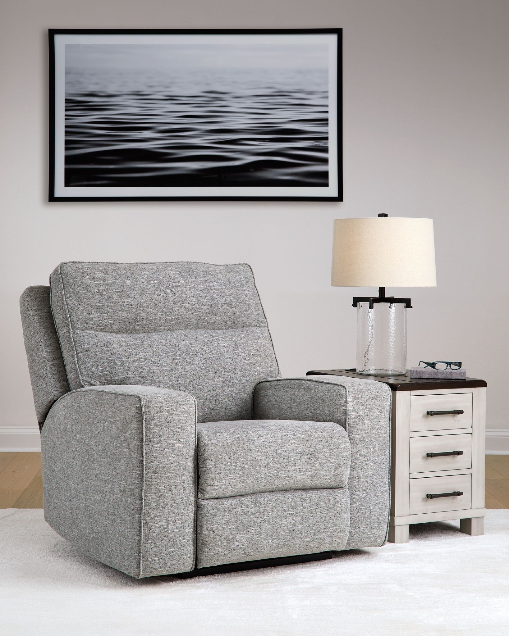 Pewter gray power recliner chair with adjustable headrest and thick padded seat
