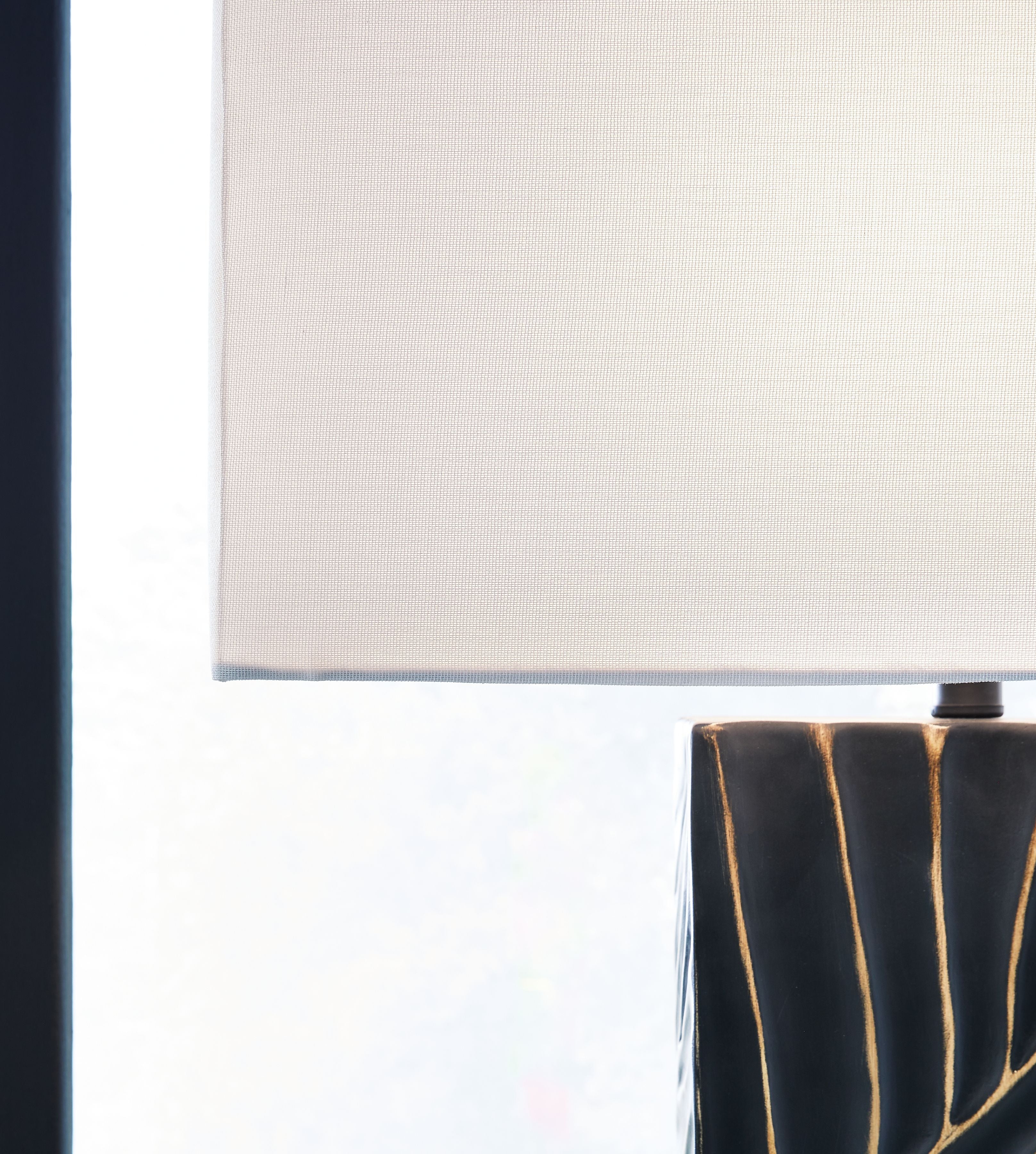 Table lamp shade edge and black base with gold line pattern