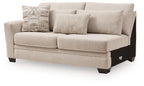 Beige upholstered loveseat with tufted back, wide seat, rolled arms, dark block legs, 3 pillows