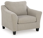 Taupe fabric chair with wide arms, cushioned seat, and dark square legs