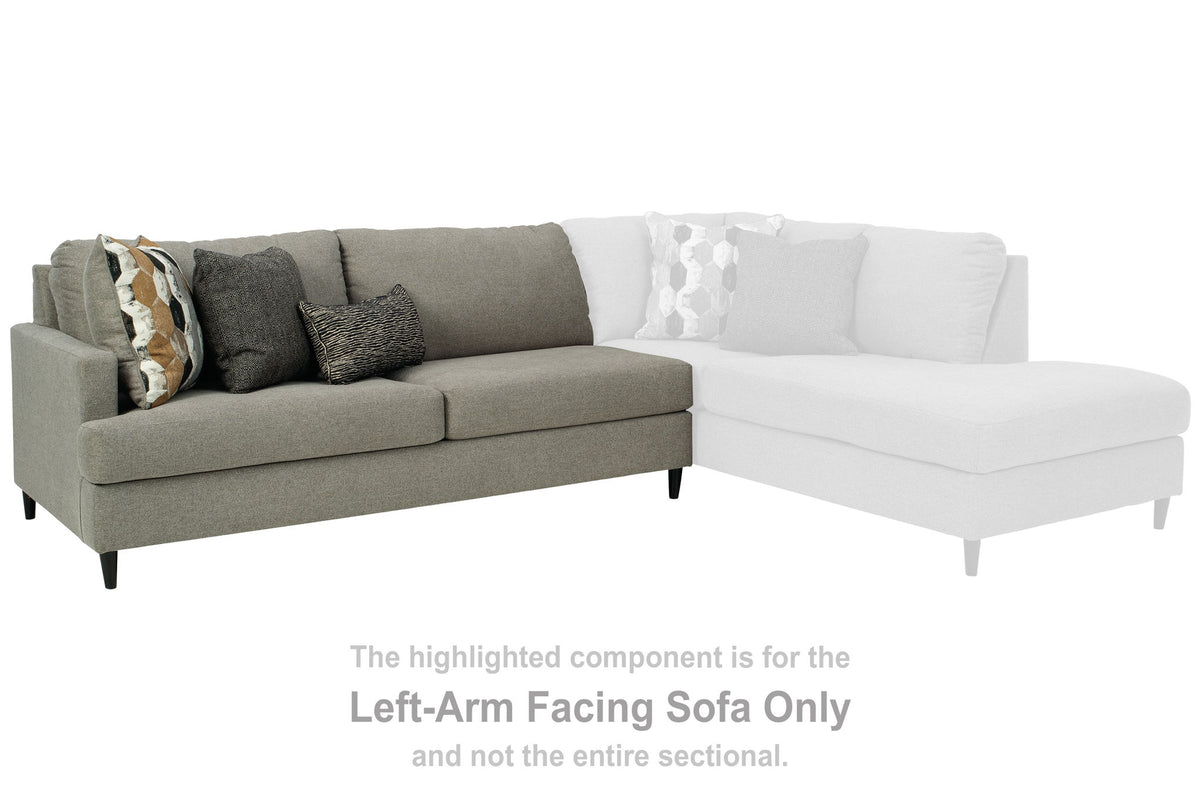Dark gray L-shaped sectional sofa with chaise and two throw pillows