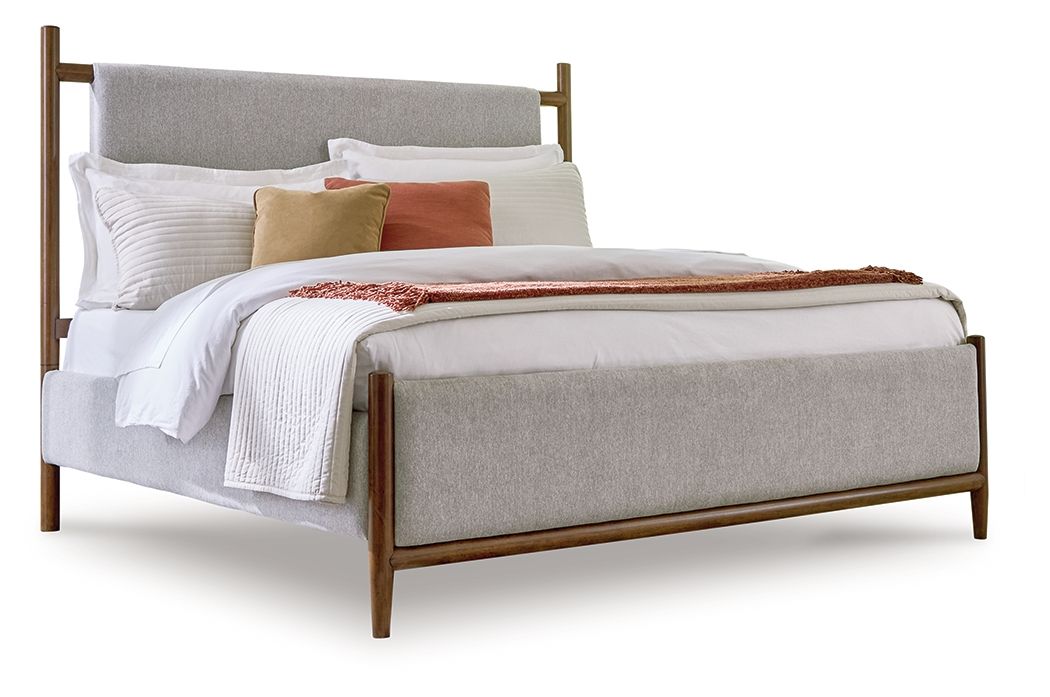 Upholstered bed with grey fabric panel and dark brown wood frame, made bed