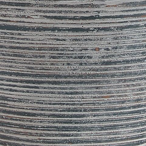 Close-up of ribbed blue-gray ceramic lamp base with speckled texture