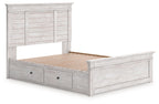 White panel storage bed with slatted base and two front drawers in the storage frame.