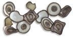 Multi-piece wall decor cluster of resin stone discs in cream, tan, and gray with rings