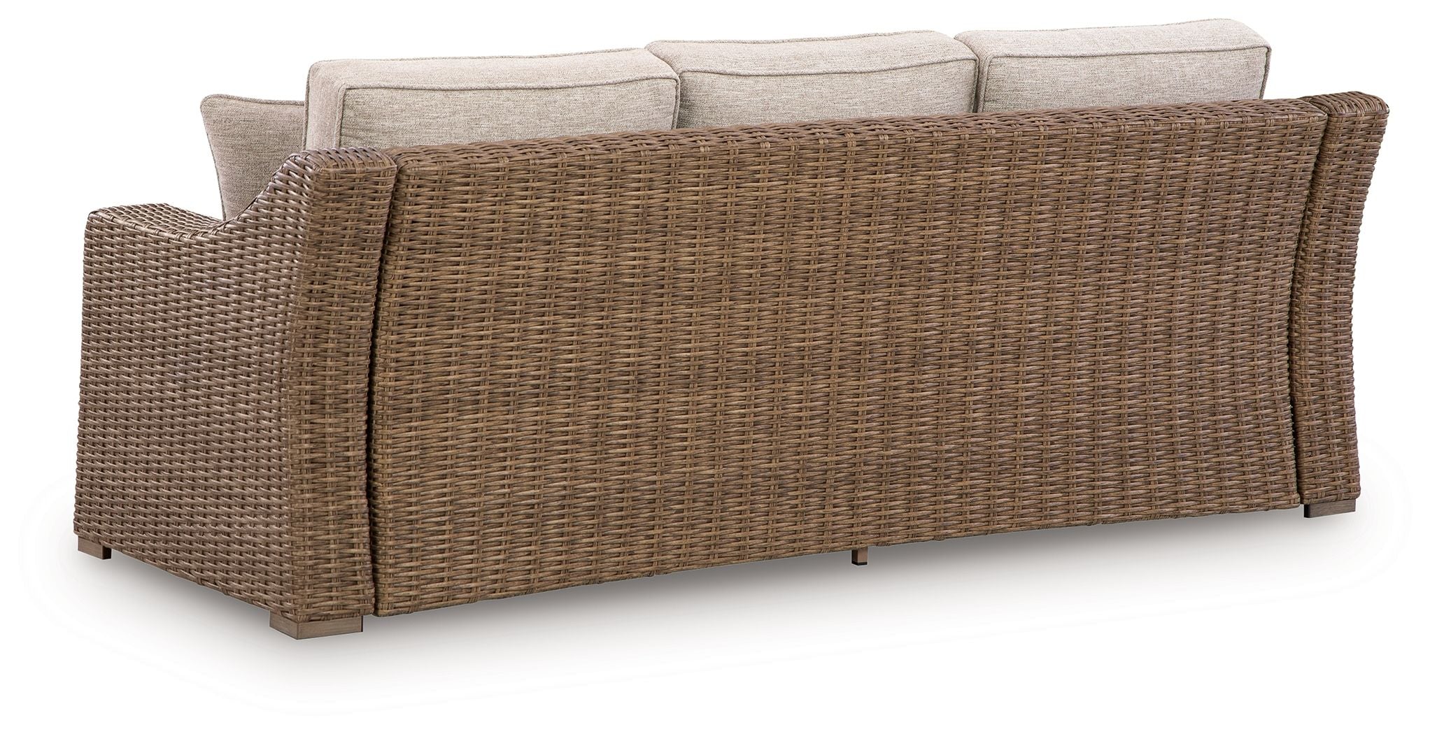 Beige sofa with woven wicker sides and back, three cushioned seats