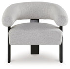 Upholstered light gray accent chair with wide arms and dark square legs