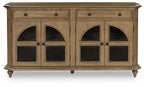 Brown sideboard-style accent cabinet with four arched glass doors and two drawers