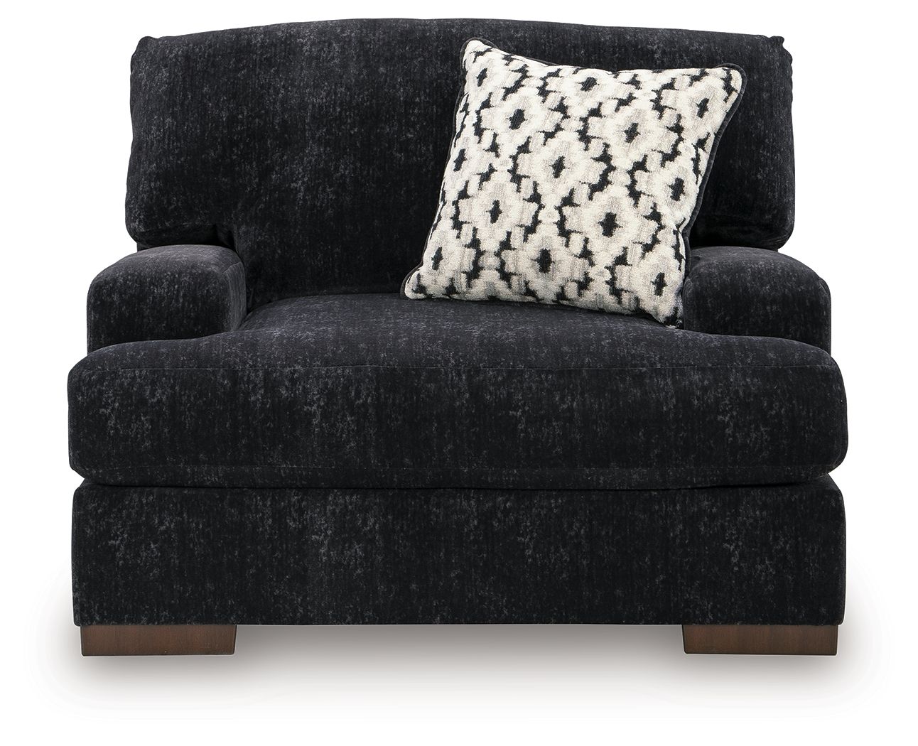 Black chair-and-a-half with top bolster back and monochrome patterned cushion