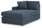 Ink blue corner chaise with thick seat, armrest, and two back pillows