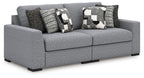 Gray fabric sectional sofa with patterned accent pillows and wide chaise-style seat