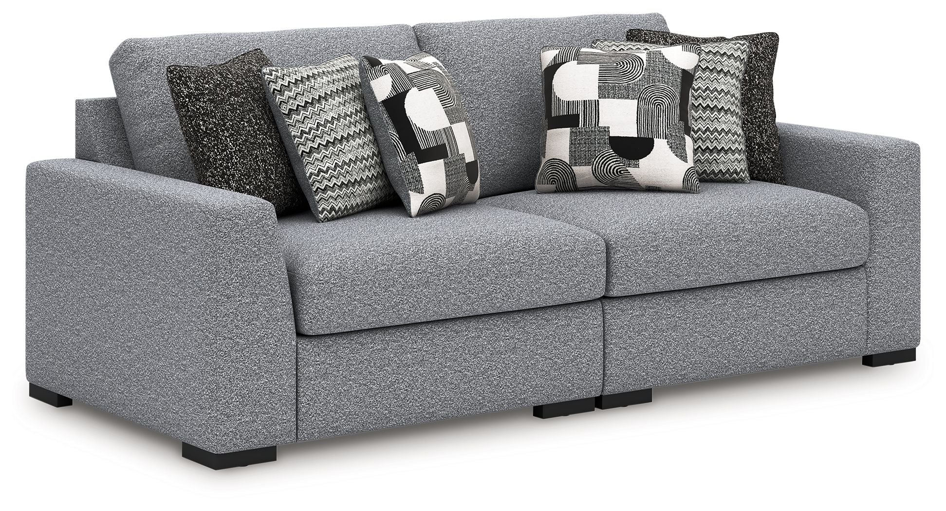Gray fabric sectional sofa with patterned accent pillows and wide chaise-style seat