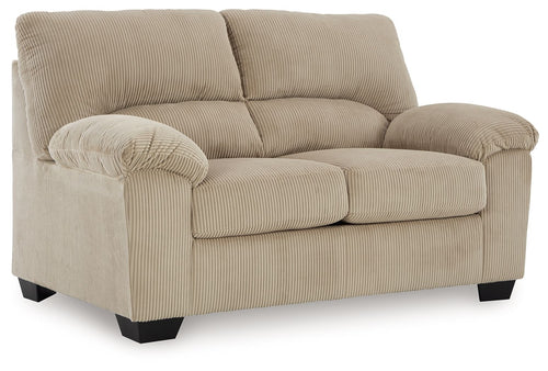 Beige corduroy loveseat with rolled arms, tufted back cushions, and dark feet