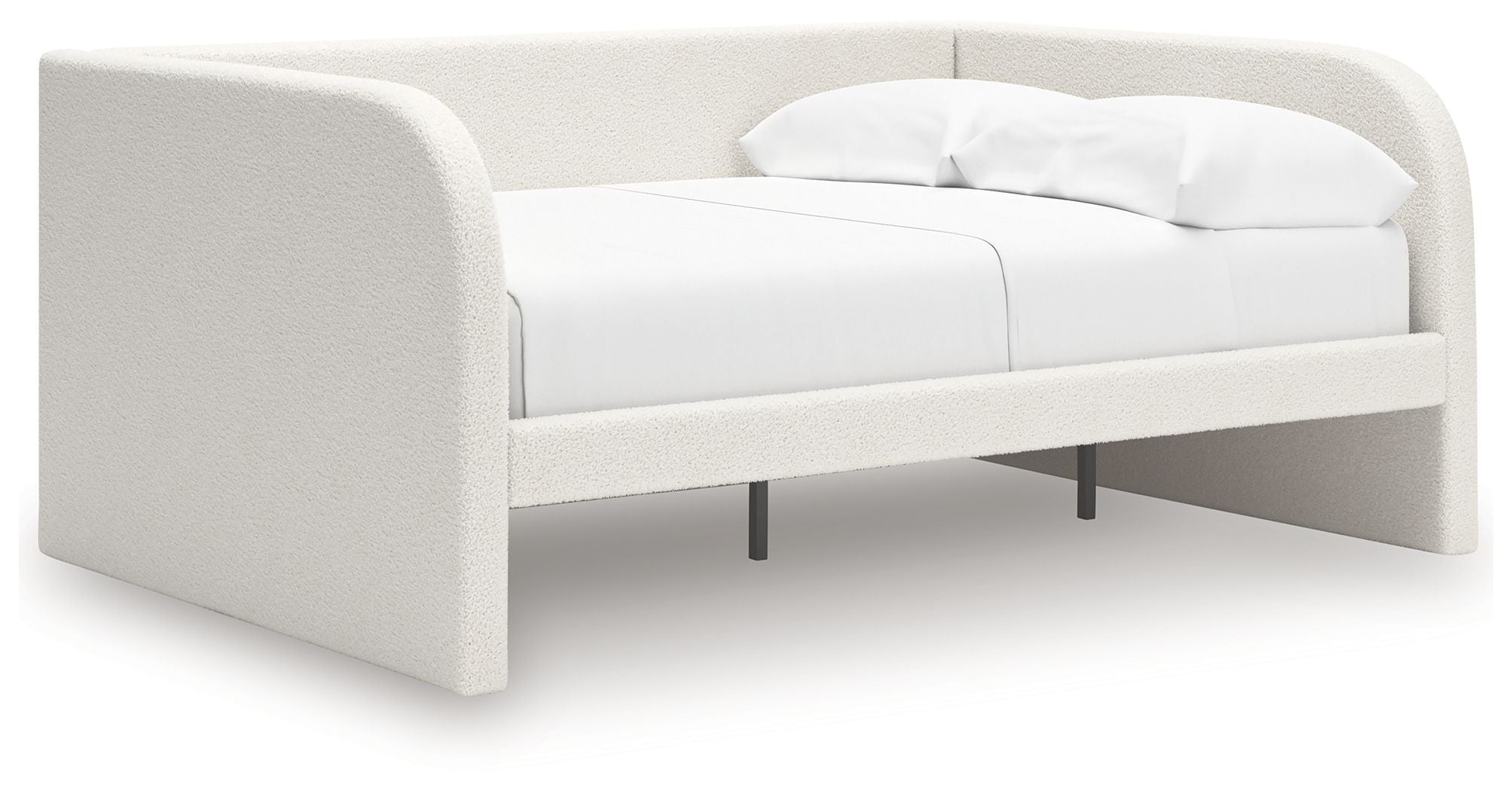 Upholstered day bed in beige fabric with white cushions; open underside with legs