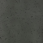 Close-up of dark speckled ceramic glaze with glossy surface