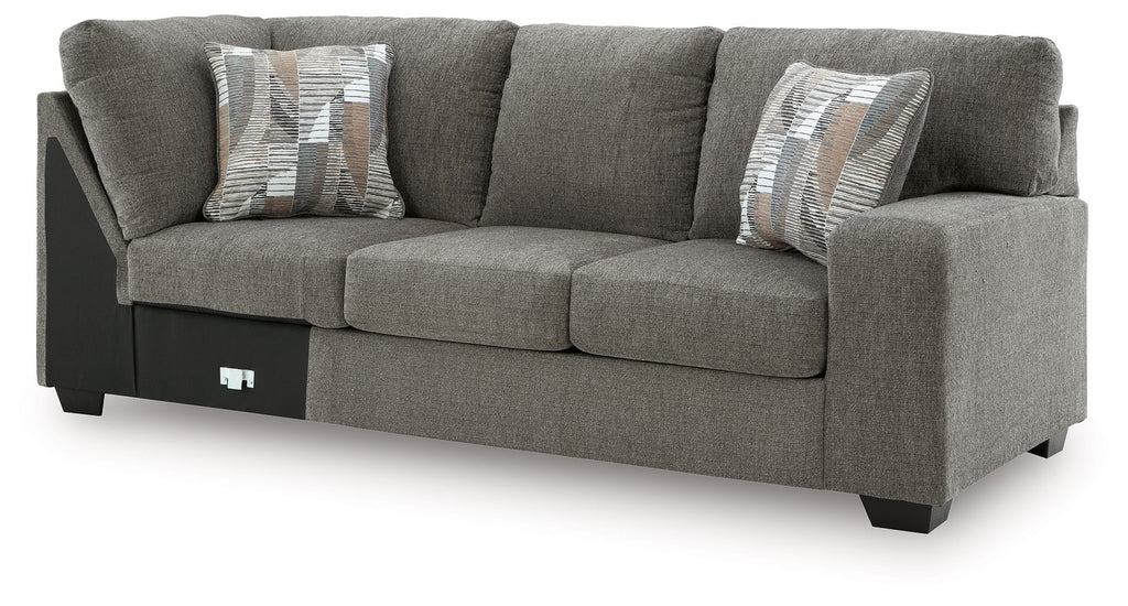 Grey RAF sectional sofa with corner wedge, upholstered arms and seat cushions