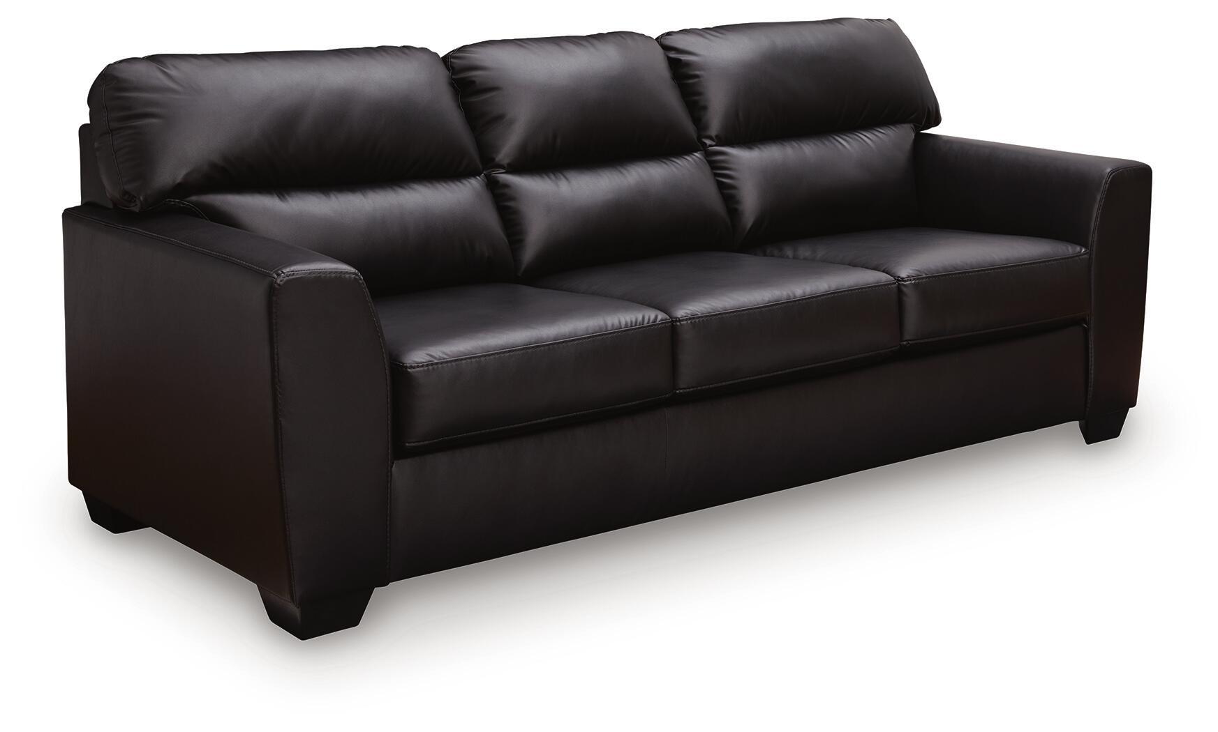 Midnight sofa in dark leather with tufted back cushions and boxy arms