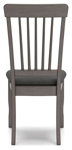 Gray dining room side chair showing vertical slat back and wide padded seat