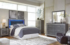 Lodanna upholstered panel bed in gray with raised headboard and low footboard