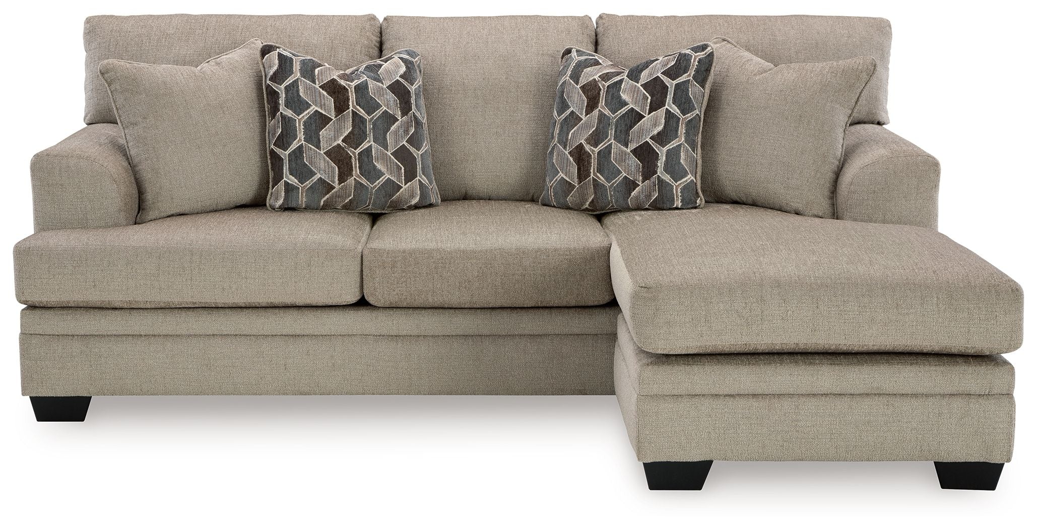 Taupe sofa chaise with three seat cushions and two geometric patterned throw pillows