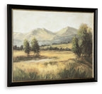 Framed landscape wall art featuring mountains, meadow, and trees; black frame.