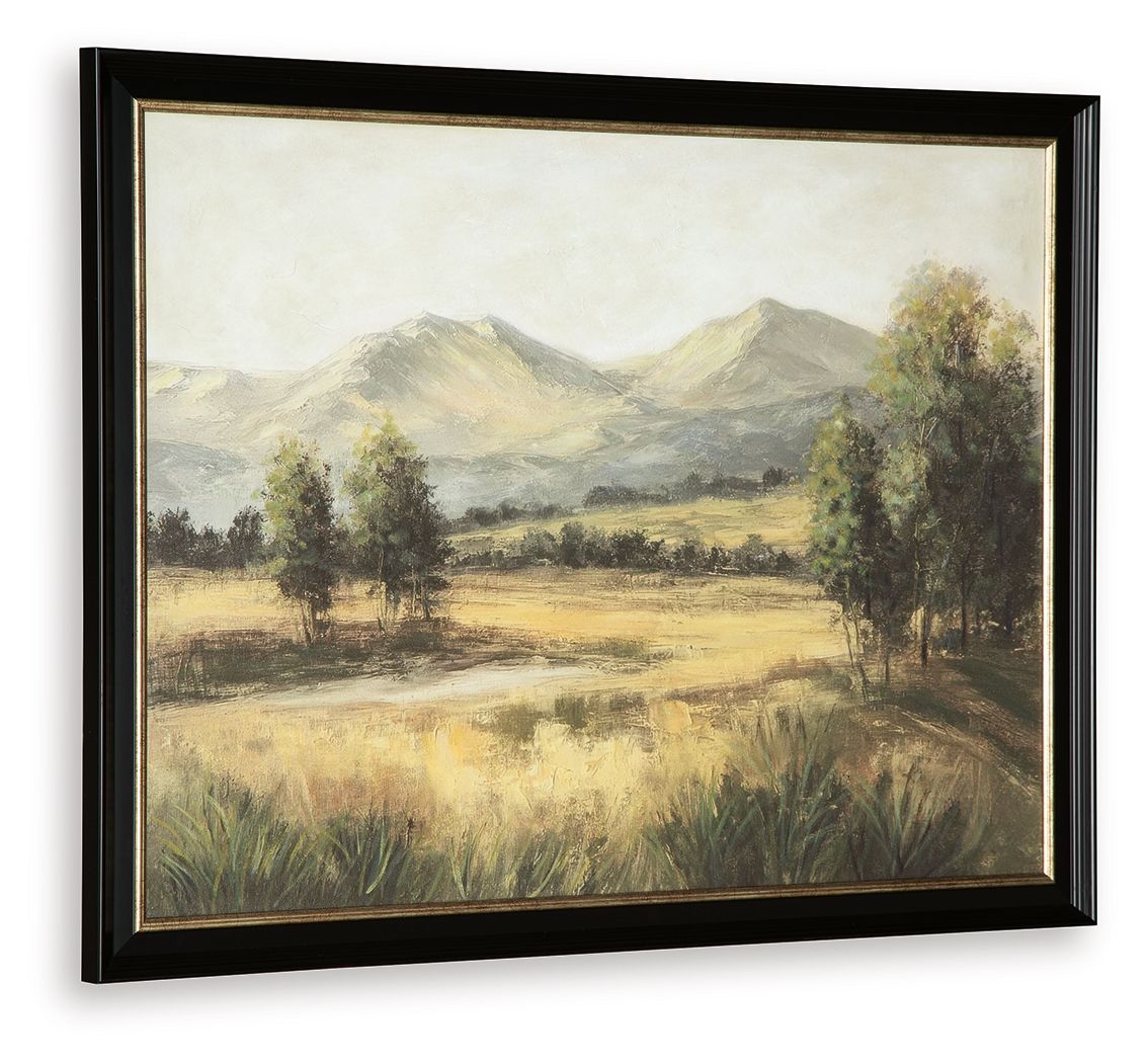 Framed landscape wall art featuring mountains, meadow, and trees; black frame.