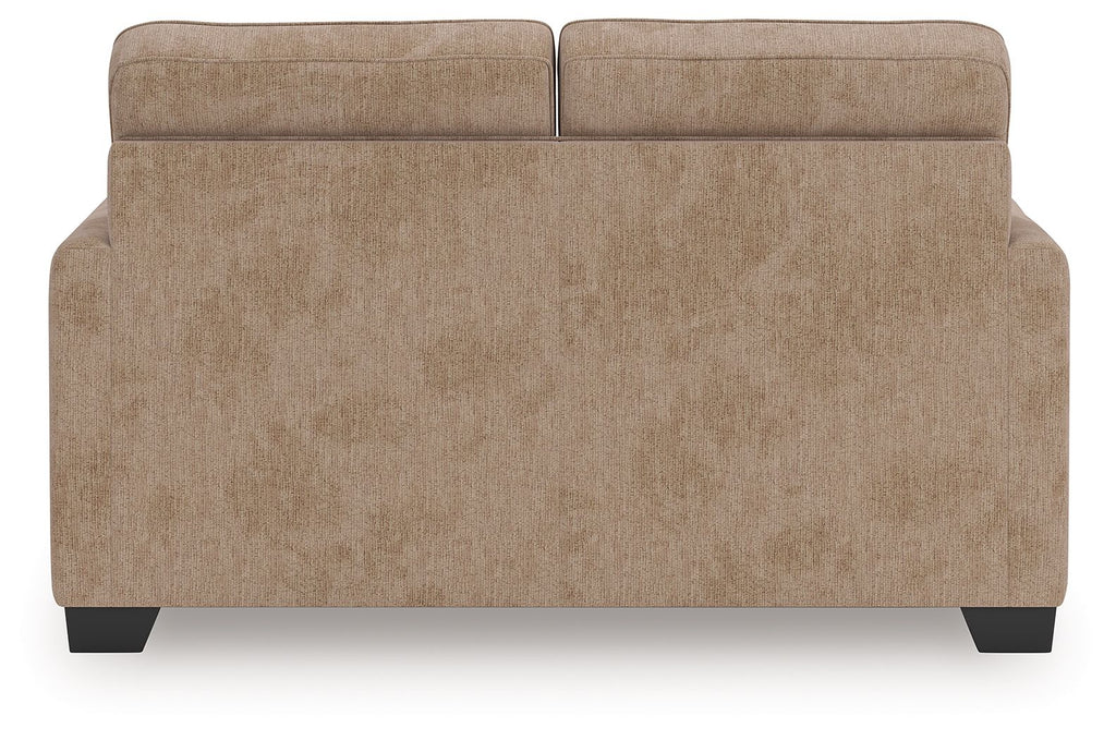 Light brown upholstered loveseat back and seat with wide arm panels