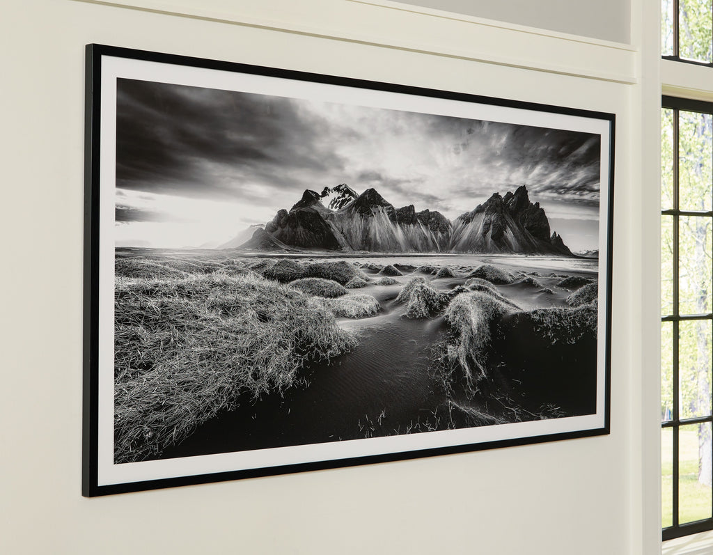 Black frame wall art with black-and-white mountain landscape, wide horizon