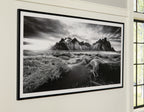 Black frame wall art with black-and-white mountain landscape, wide horizon