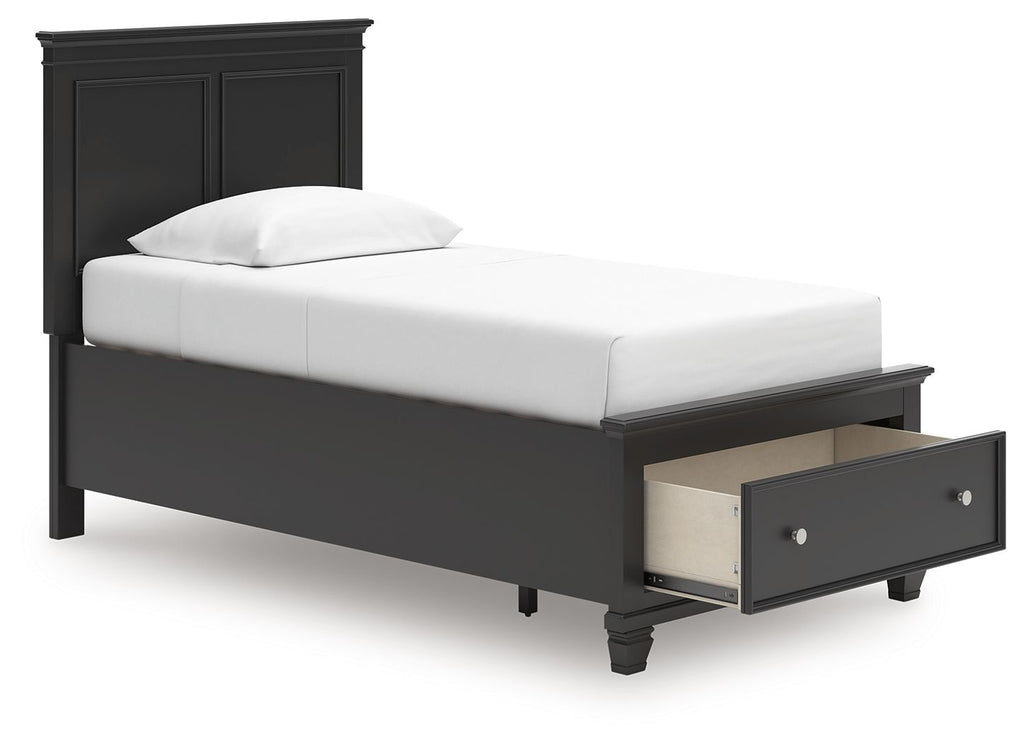 Black panel bed with a single storage drawer beneath the foot end.
