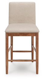 Upholstered barstool with beige cushioned seat, backrest, and light wood frame