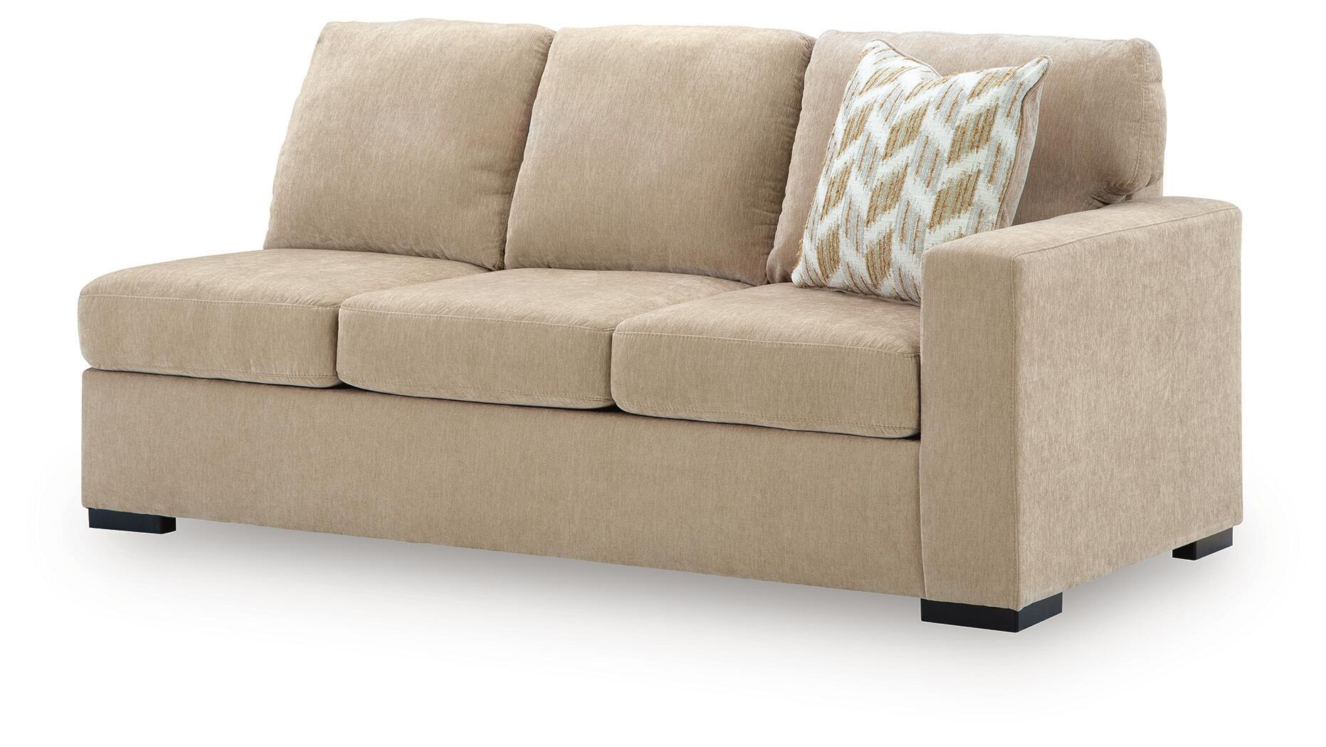 Almond upholstered RAF sofa with three seat cushions, square arms, and black feet