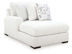 Chalk fabric corner chaise with thick seat, two back cushions, patterned square throw pillows