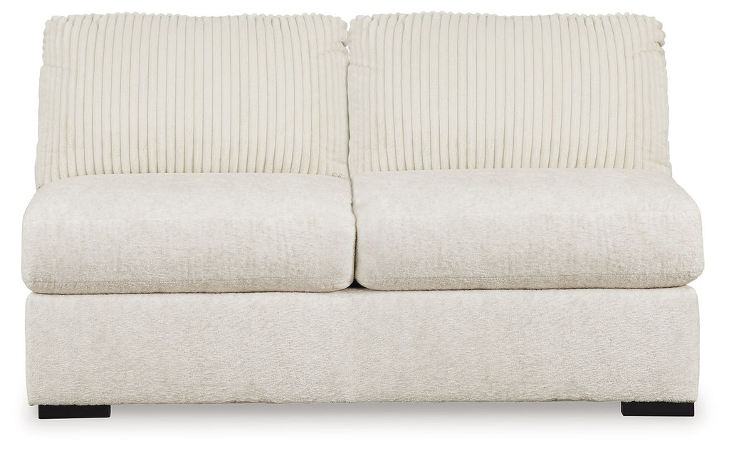Ivory armless loveseat with two-seat back cushions and textured upholstery, black legs
