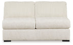 Ivory armless loveseat with two-seat back cushions and textured upholstery, black legs