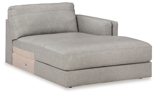 Light gray upholstered chaise lounge with wide seat and padded corner back