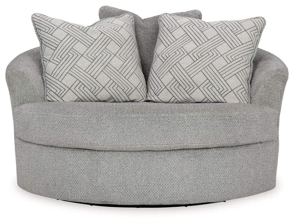 Oversized swivel accent chair in cement gray with two back cushions in geometric pattern
