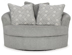 Oversized swivel accent chair in cement gray with two back cushions in geometric pattern