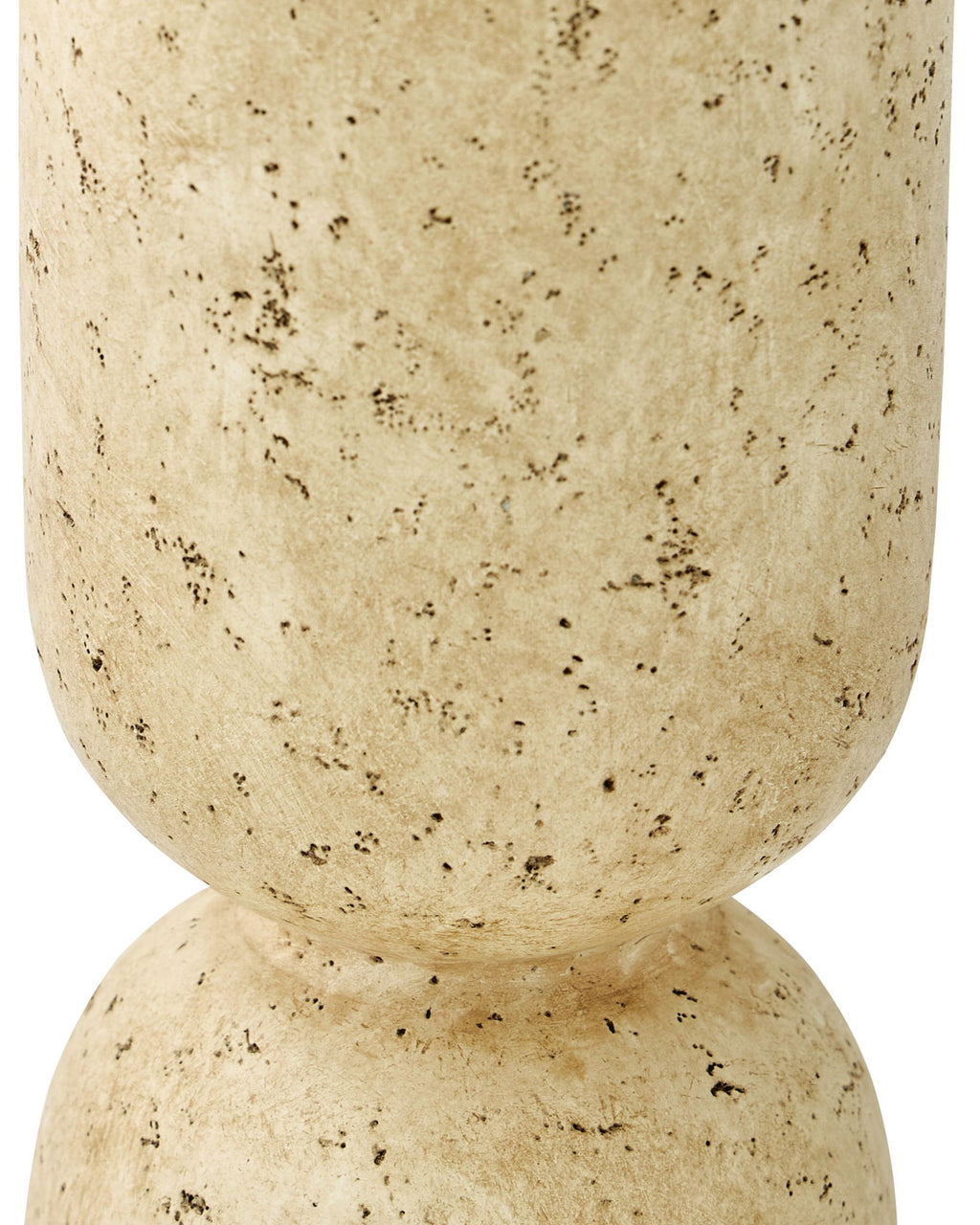Beige speckled vase close-up, flared top and rounded pedestal