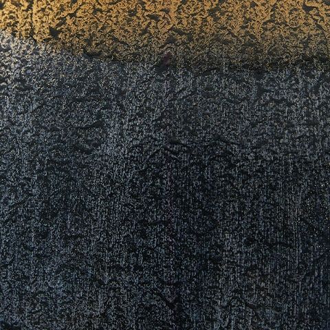 Blue textured metal lamp surface with speckled pattern