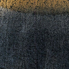 Blue textured metal lamp surface with speckled pattern