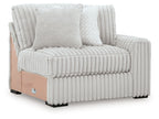 RAF corner chair with ribbed light gray cushions and left-side armrest