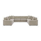 Beige 8-piece sectional sofa with tufted back cushions and rounded arm sections