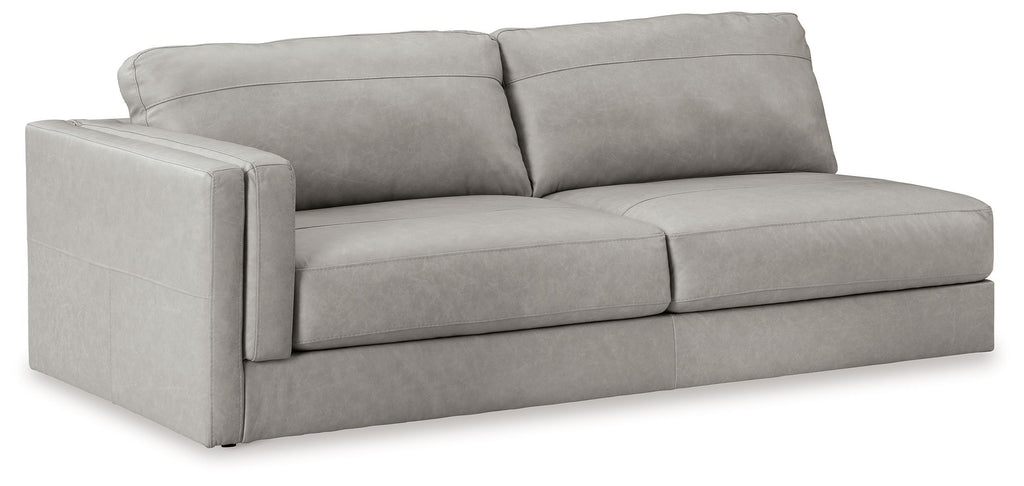 Light gray two-seat Laf sofa with boxy arms and tufted seat cushions