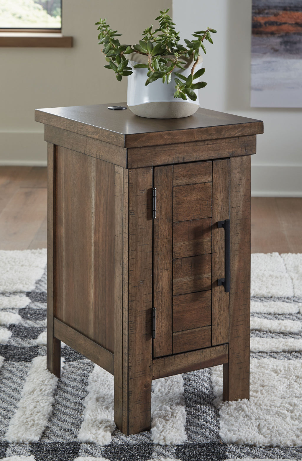 Gray-brown chair side end table with cabinet door, top hole, and side metal pulls