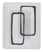 Beige abstract rug with black outlined rectangles pattern