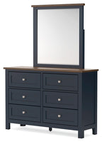 Dark blue dresser with mirror, brown top, six drawers, silver knobs