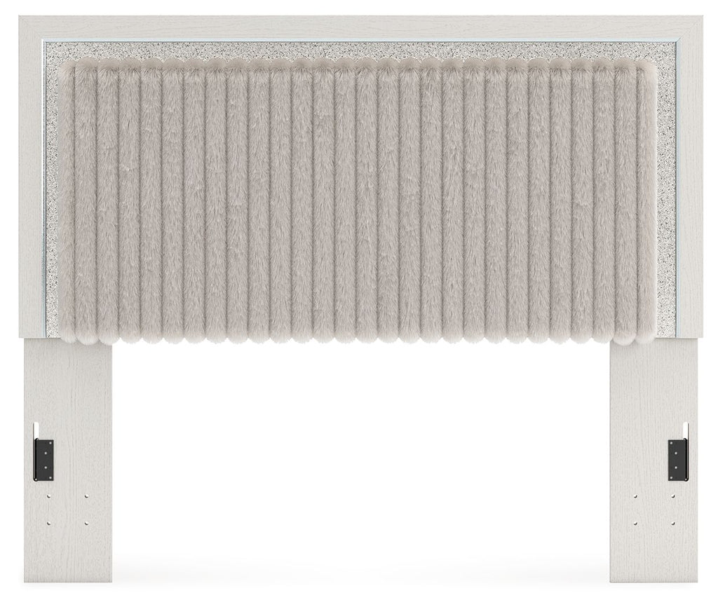 Upholstered panel headboard with light ribbed upholstery and tufted lower trim