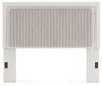 Upholstered panel headboard with light ribbed upholstery and tufted lower trim