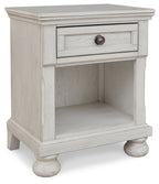 Antique white one-drawer night stand with open lower shelf and curved pedestal legs